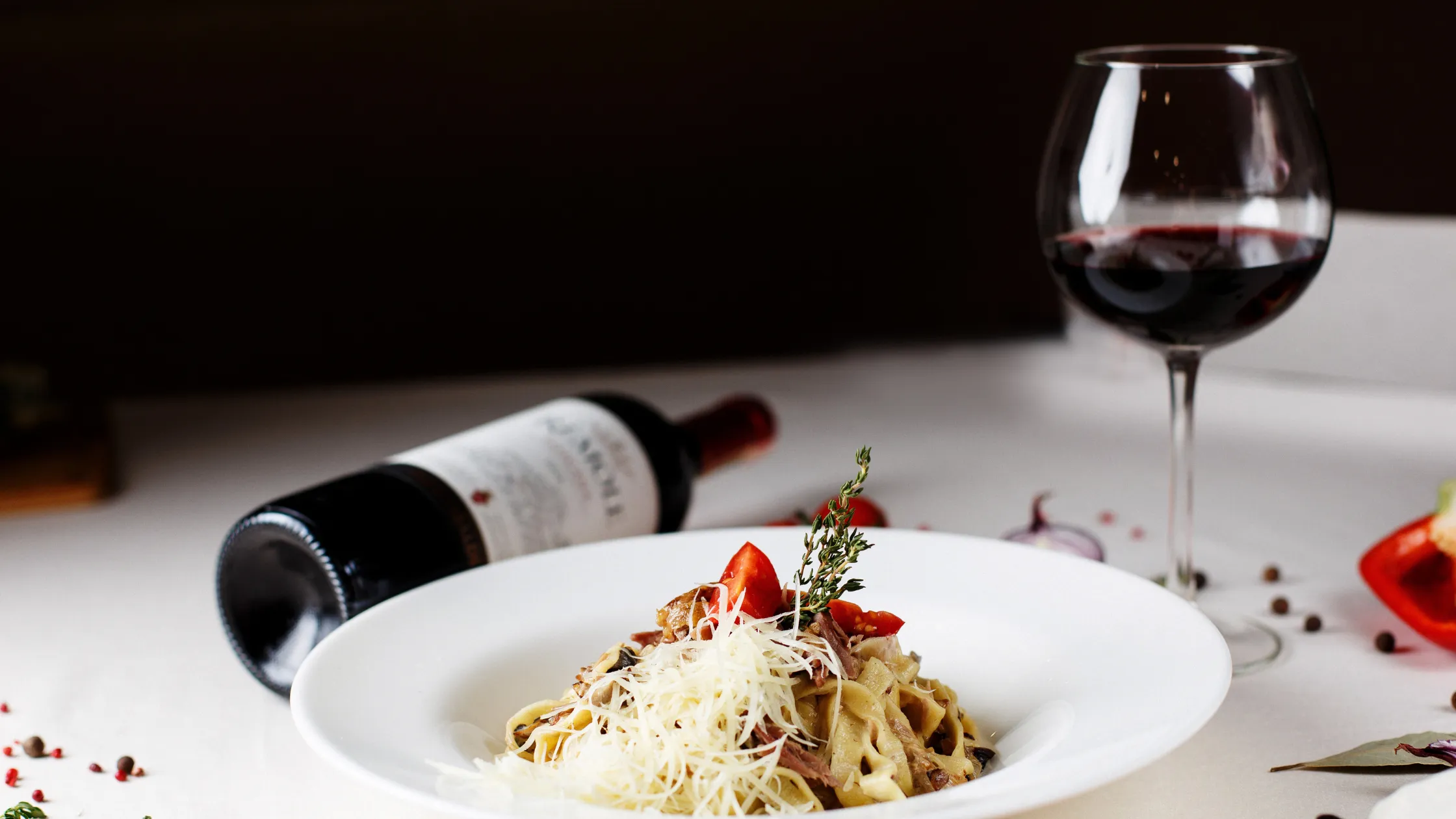 A romantic dinner setup with wine glasses, perfect for Valentine's Day wine pairing.